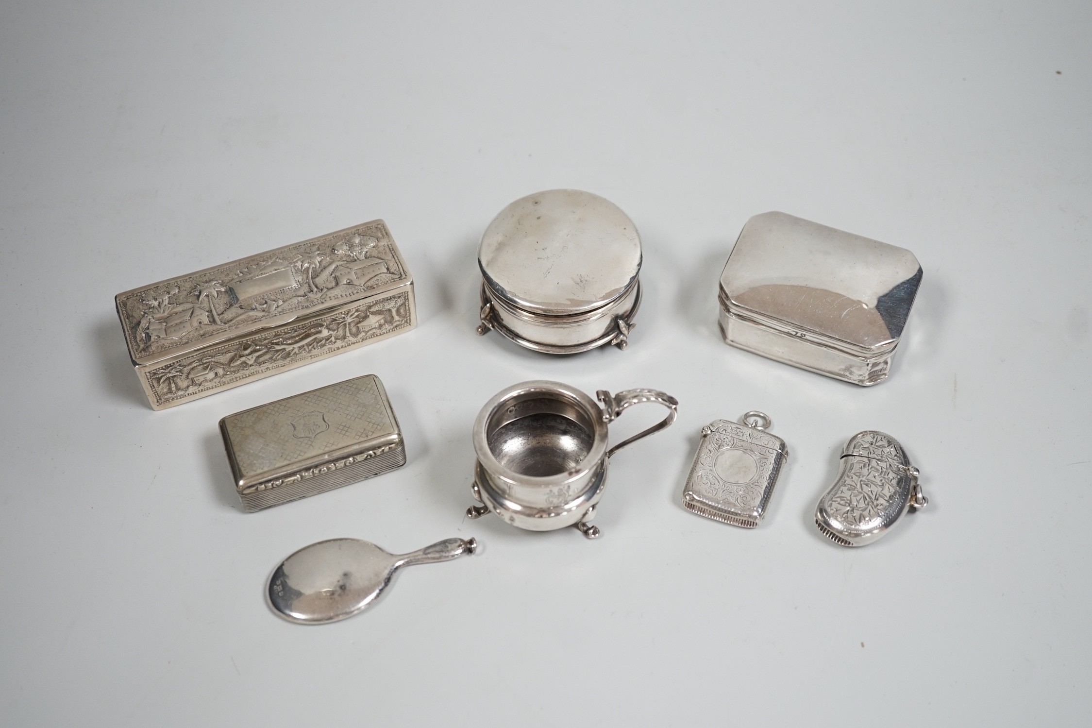 A collection of small silver items including two trinket boxes, a damaged mustard pot, two vesta case, snuff box etc. and a white metal box.